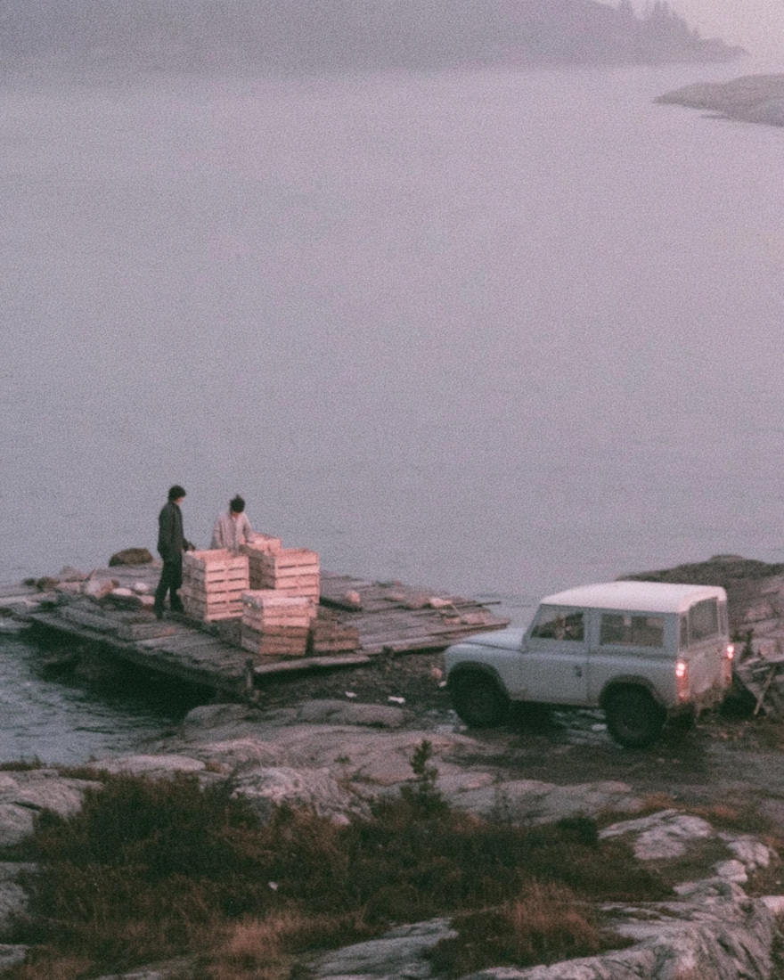Crates loaded onto a timber jetty.
